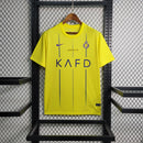 camisa-camiseta-al-nassr-kafd-nike-versao-versao-torcedor-masculina-23-24-home-casa-i-principal-1-cr7-cristiano-ronaldo-talisca-anderson-amarela-amarelo-azul_1