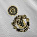 camisa-camiseta-manga-longa-manchester-united-umbro-vodafone-versao-versao-retro-retro-beckham-david-dupla-face-torcedor-masculina-01-02-comemorativa-100-anos-preta-preto-dourado-dour_b8687eef-22e2-400f-b5e3-355ae5e73cd7