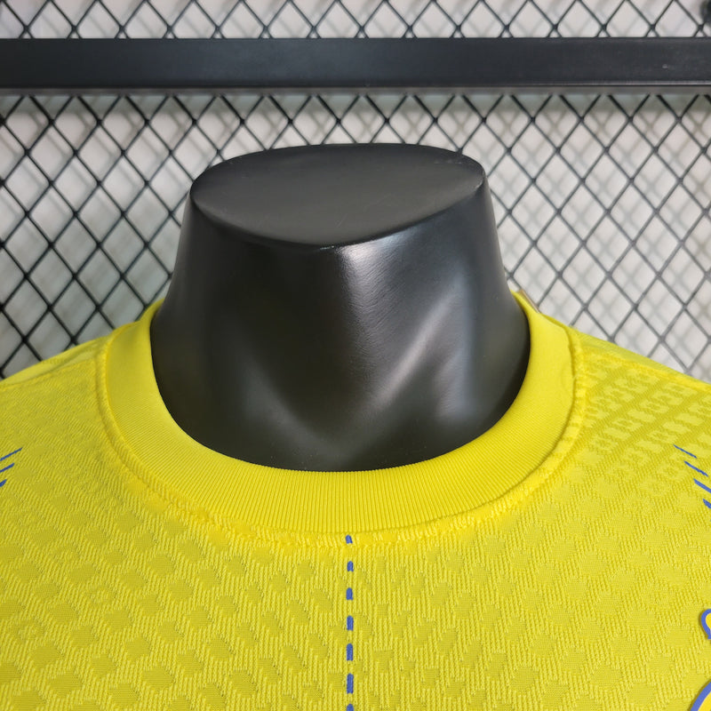 camisa-camiseta-al-nassr-kafd-nike-versao-versao-jogador-masculina-23-24-home-casa-i-principal-1-cr7-cristiano-ronaldo-talisca-anderson-amarela-amarelo-azul_4