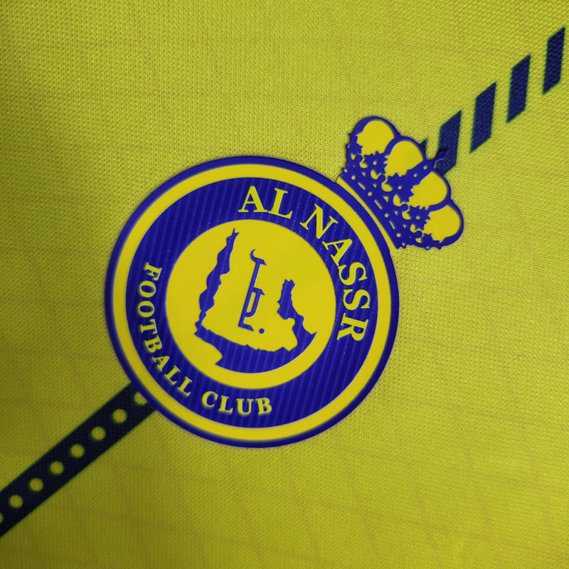 camisa-camiseta-al-nassr-kafd-nike-versao-versao-torcedor-masculina-23-24-home-casa-i-principal-1-cr7-cristiano-ronaldo-talisca-anderson-amarela-amarelo-azul_2