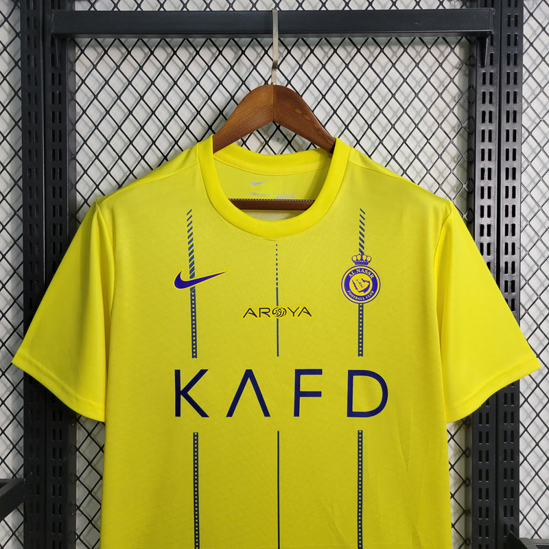camisa-camiseta-al-nassr-kafd-nike-versao-versao-torcedor-masculina-23-24-home-casa-i-principal-1-cr7-cristiano-ronaldo-talisca-anderson-amarela-amarelo-azul_3